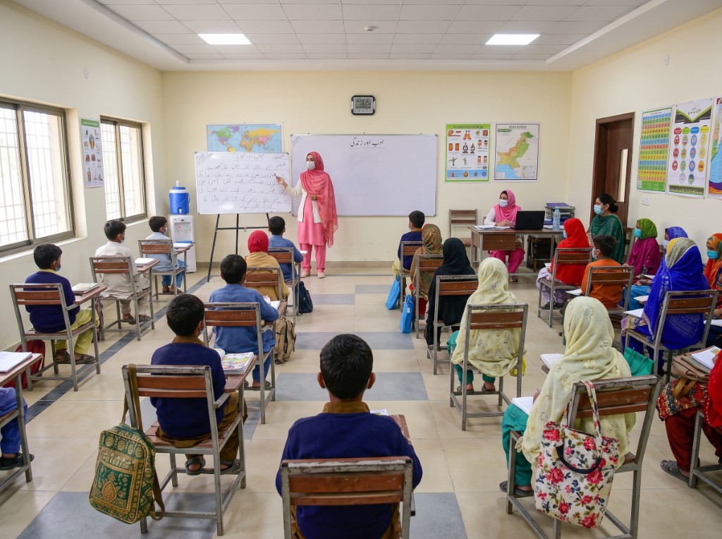 Teacher leading a classroom of students